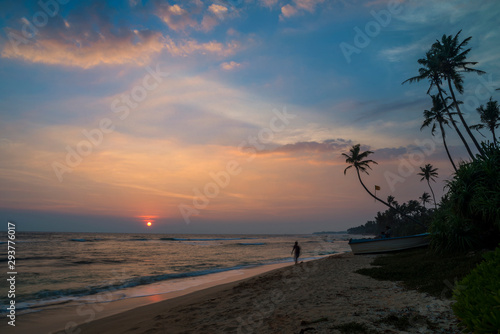 Red sun going down at Polhena Beach, Matara District, Southern Province, Sri Lanka