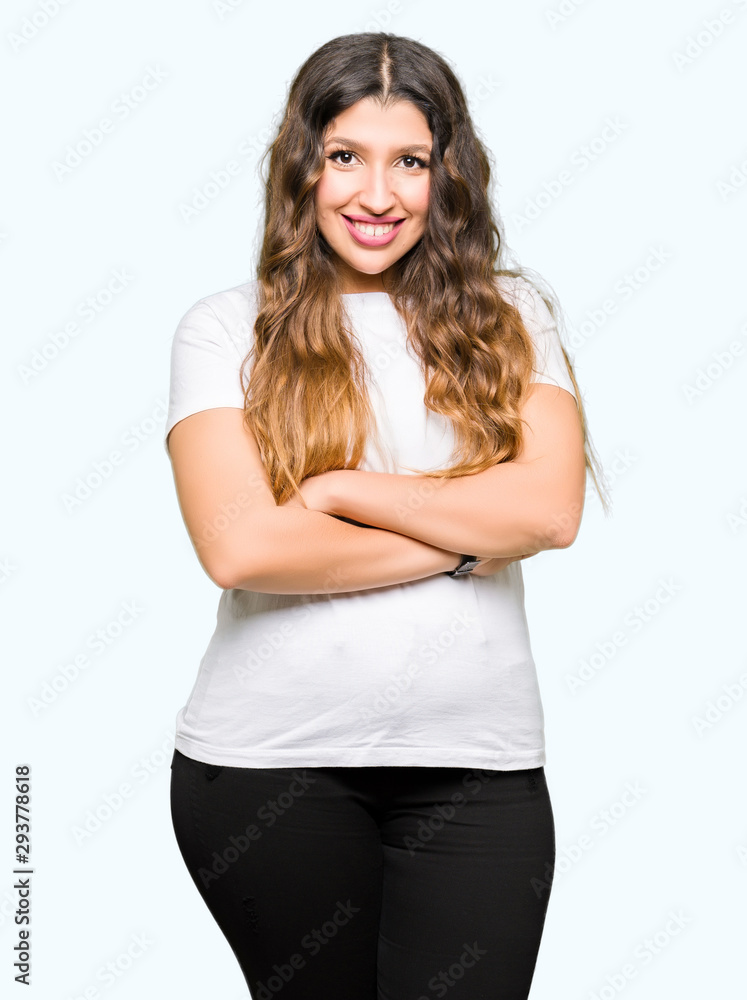 Young beautiful woman wearing casual white t-shirt happy face smiling with crossed arms looking at the camera. Positive person. Young beautiful woman wearing casual white t-shirt happy face smiling with crossed arms looking at the camera. Positive person.