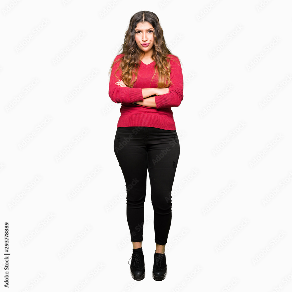 Young beautiful woman wearing red sweater skeptic and nervous, disapproving expression on face with crossed arms. Negative person. Young beautiful woman wearing red sweater skeptic and nervous, disapproving expression on face with crossed arms. Negative person.