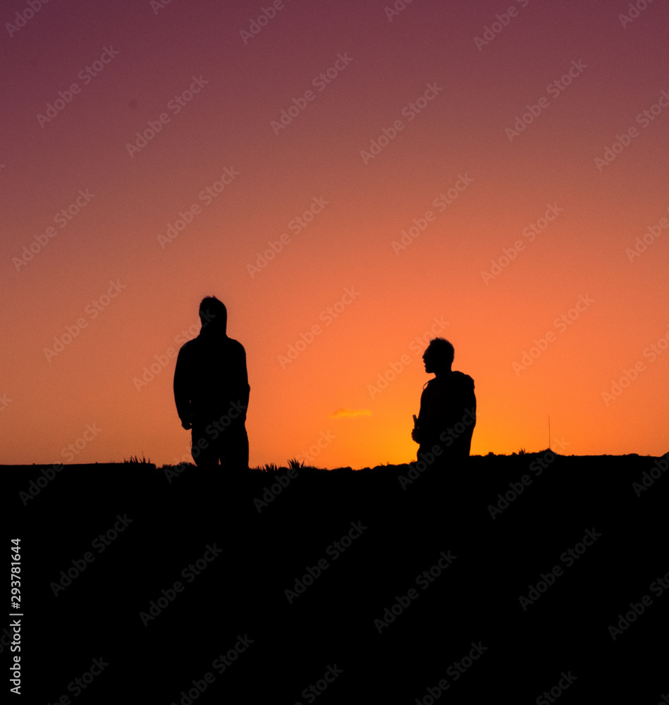 silhouette of man on background of sunset
