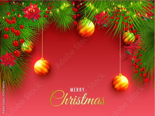 Merry Christmas greeting design decorated with green grass, flowers and hanging baubles on red background.