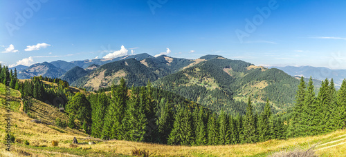 Aerial view amazing over of the Carpathian Mountains or Carpathians with Beautiful summer landscape, sunny day, blue sky with white clouds