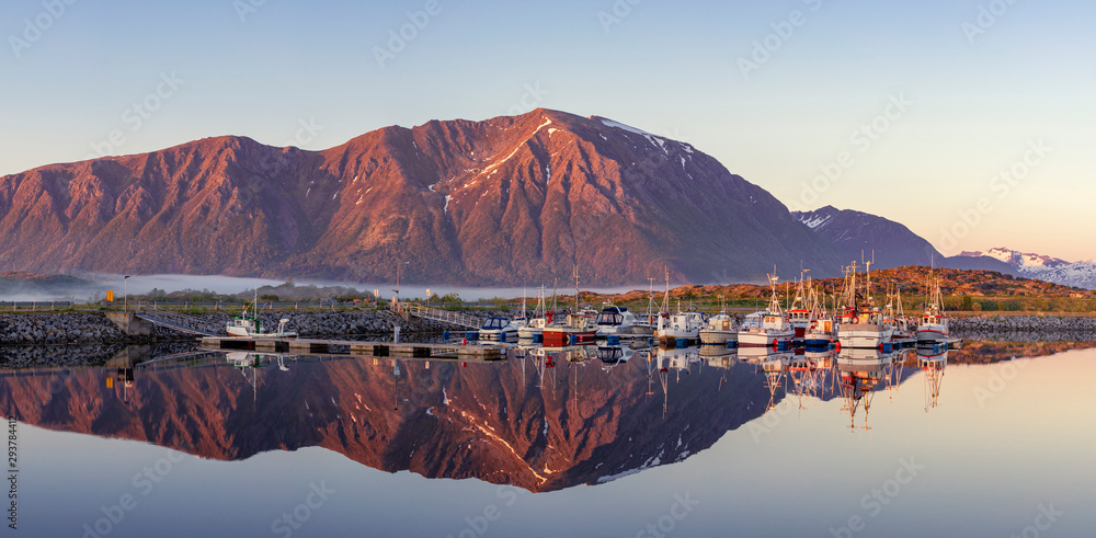 Laukvik, Lofoten Islands, Norway, Fishing boats in harbor at midnight sun, Mountain With Snow In Background