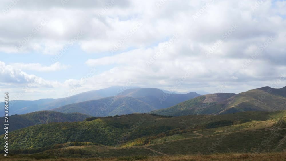Scenic panoramic view of summer landscape with mountain pastures and beautiful clouds in the sky Scenic panoramic view of summer landscape with mountain pastures and beautiful clouds in the sky