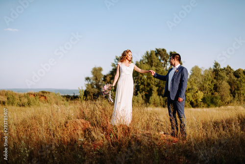 Bride and groom on the background of beautiful nature