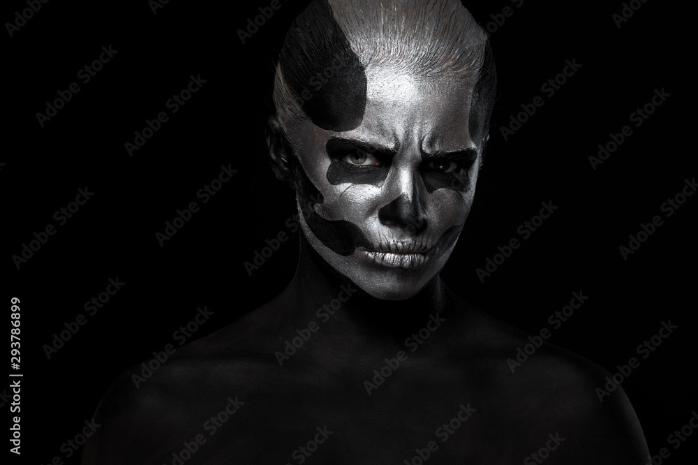 Halloween. Woman in day of the dead mask skull face art. Halloween face art on black background. Halloween make up. Halloween. Woman in day of the dead mask skull face art. Halloween face art on black background. Halloween make up.