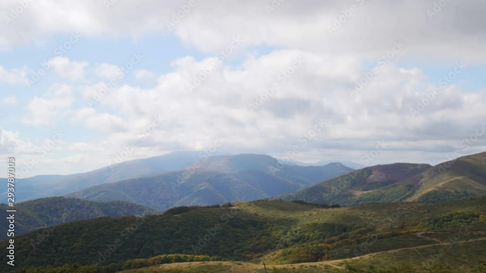 Scenic panoramic view of summer landscape with mountain pastures and beautiful clouds in the sky Scenic panoramic view of summer landscape with mountain pastures and beautiful clouds in the sky