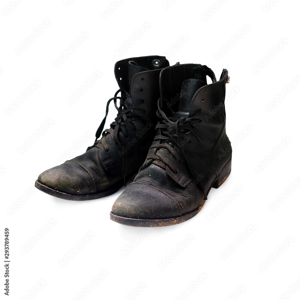 Old worn black boots isolated on a white background. Equestrian boots Old worn black boots isolated on a white background. Equestrian boots