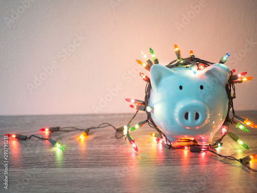 Blue piggy bank with Party lights, Enjoy savings for the holidays concept