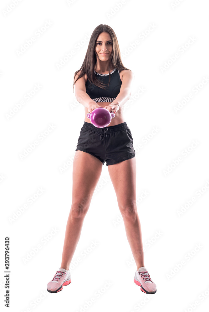 Part of series. Young athletic woman doing kettlebell exercises workout. Full body isolated on white background. Part of series. Young athletic woman doing kettlebell exercises workout. Full body isolated on white background.