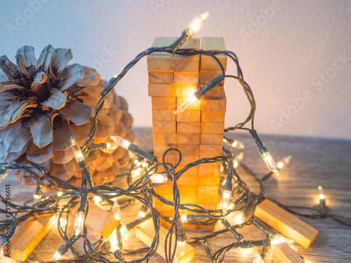 Wooden block tower with Party lights, Funly Planning Alternative Risk management and Strategy in Business concept photo