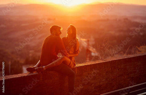 Lovers. romantic at sunset. Couple smiling and enjoying together.