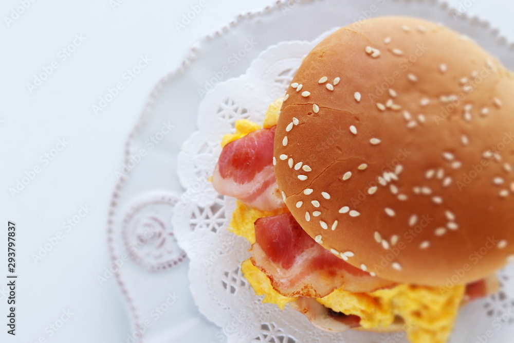Homemade scrambled egg and bacon burger with copy space Homemade scrambled egg and bacon burger with copy space