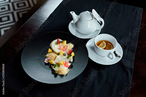 cup of tea and cake on table