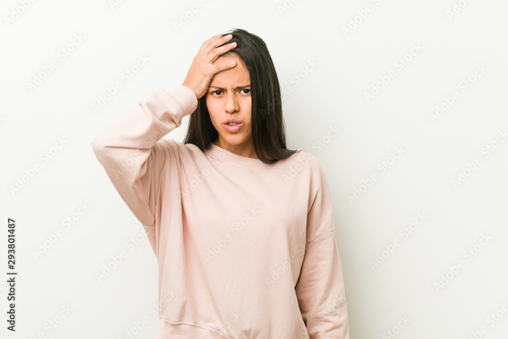 Young cute hispanic teenager woman tired and very sleepy keeping hand on head. Young cute hispanic teenager woman tired and very sleepy keeping hand on head.