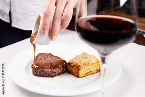 steak on plate with fork and knife
