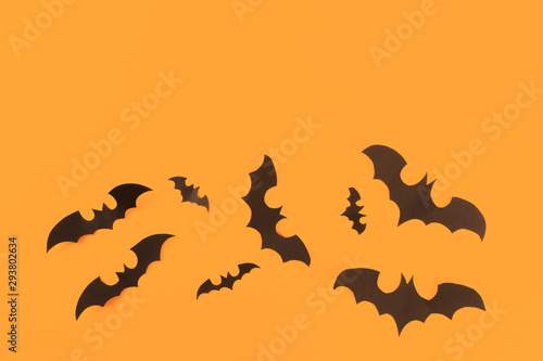 Halloween paper decorations on orange background. Halloween concept. Flat lay, top view, copy space - Image