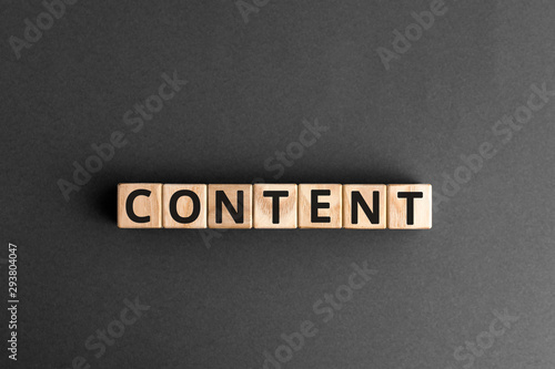 Content - word from wooden blocks with letters, content concept, random letters around, white  background