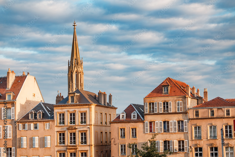 A row of houses in Metz against the backdrop of the Temple de Garnison tower.