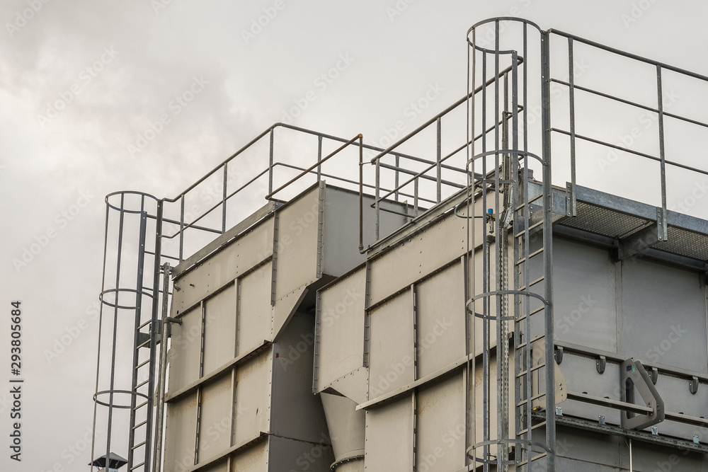 upper part of an industrial building with stairs, railings