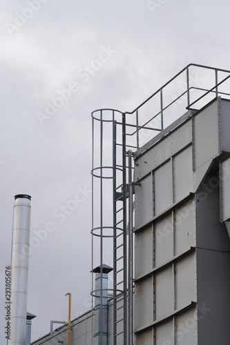 upper part of an industrial building with stairs  railings