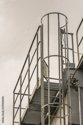 upper part of an industrial building with stairs, railings