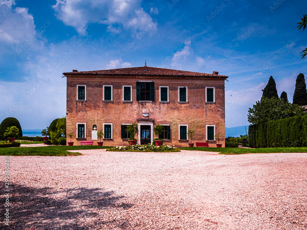 Typical and traditional Italian villa architecture with blue sky background