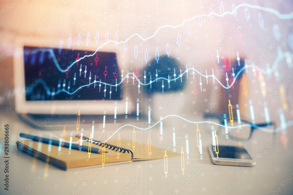 Forex Chart hologram on table with computer background. Double exposure. Concept of financial markets. Forex Chart hologram on table with computer background. Double exposure. Concept of financial markets.