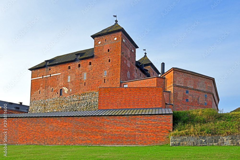 Famous medieval fortress on coast of lake Vanajavesi in old Hameenlinna, Finland