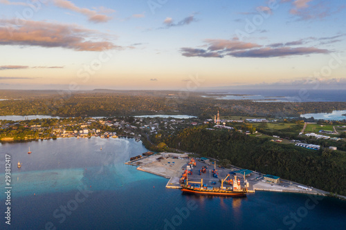 Aerial view of a container ship loading cargo in the commercial dock of Port Vila, Vanuatu capital city in the south Pacific