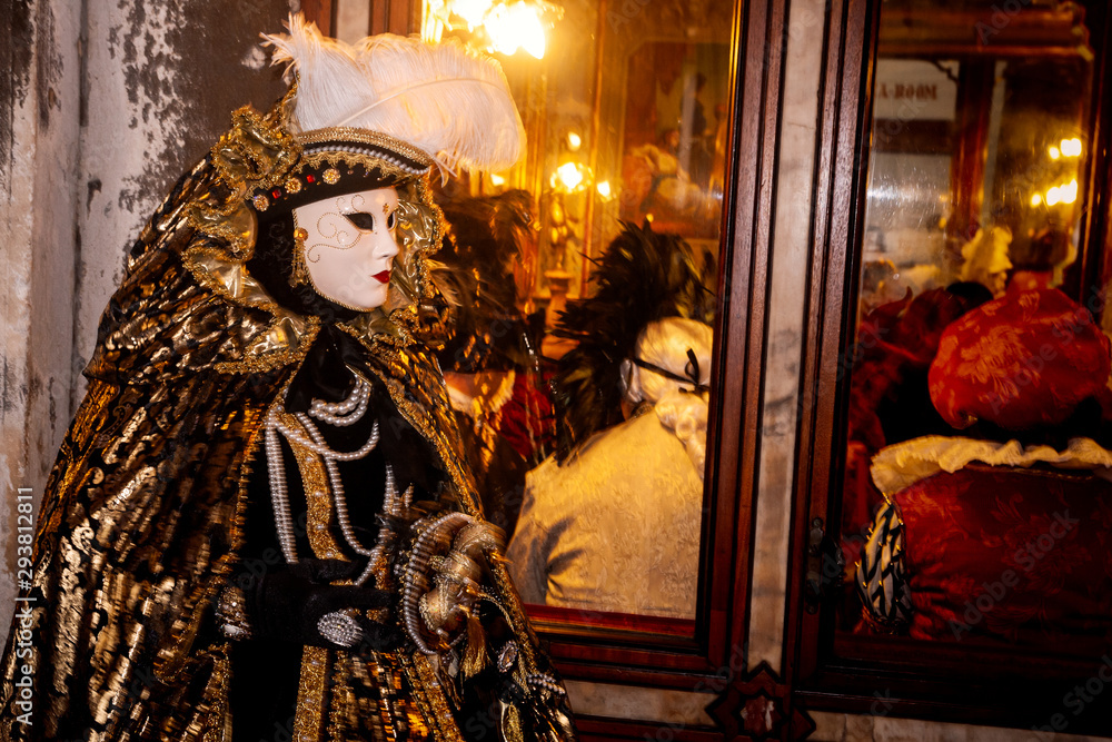 Costumed woman near the Piazza San Marco during Venice Carnival.