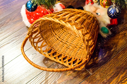 Wicker basket under the Christmas tree.