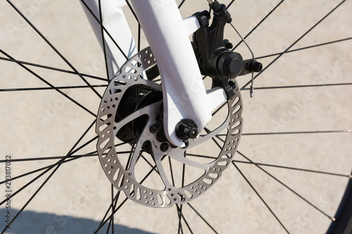 Closeup of a bicycle front disc brake. High quality hydraulic braking system available in the bicycle industry