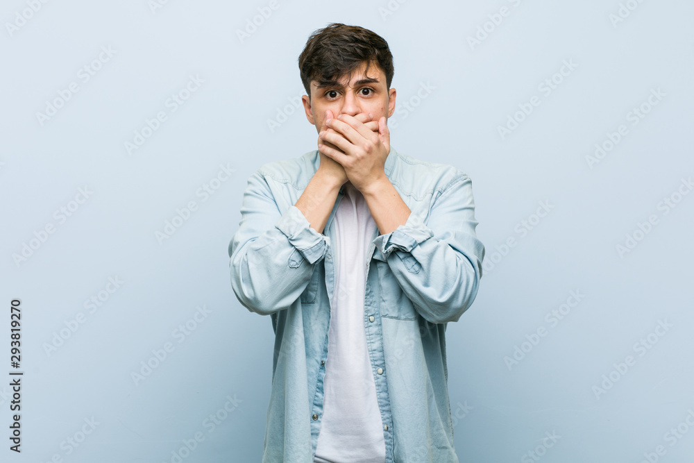 Young hispanic cool man shocked covering mouth with hands. Young hispanic cool man shocked covering mouth with hands.