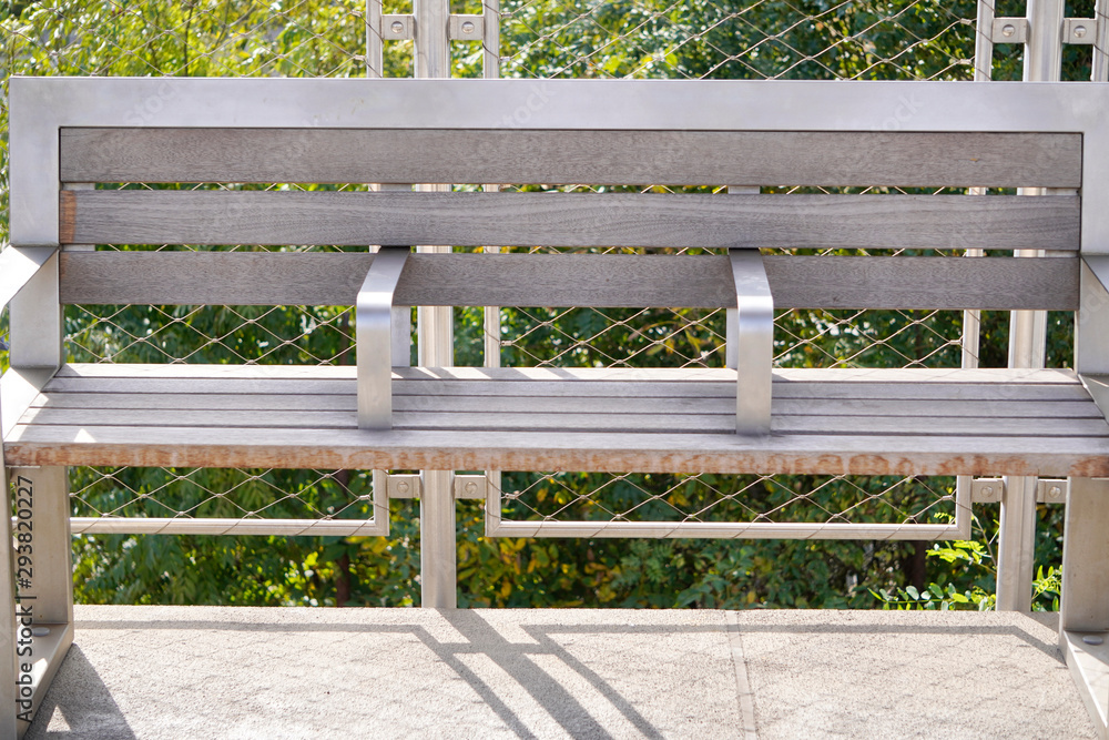 modern bench made of metal and wood with a place for things, a comfortable place to relax before the road. designing for people modern bench made of metal and wood with a place for things, a comfortable place to relax before the road. designing for people