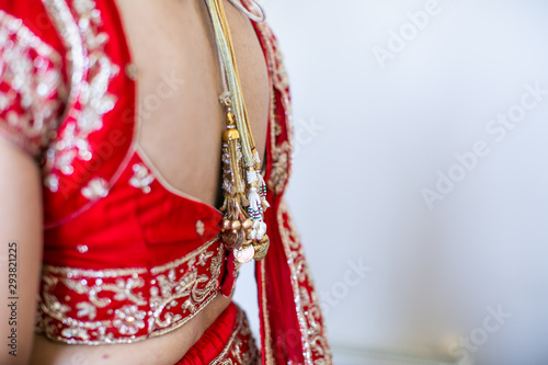 Indian hindu bride's wearing her wedding jewellery close up