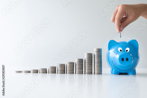 blue piggy bank with coins bar graph, step up start up  business to suscess, Saving money for future plan and retirement fund concept photo