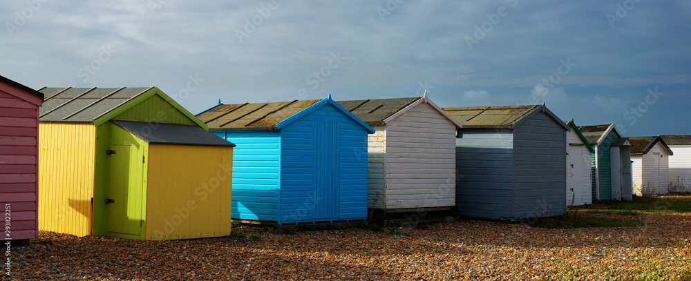 beach huts on a beach on a sunny day beach huts on a beach on a sunny day