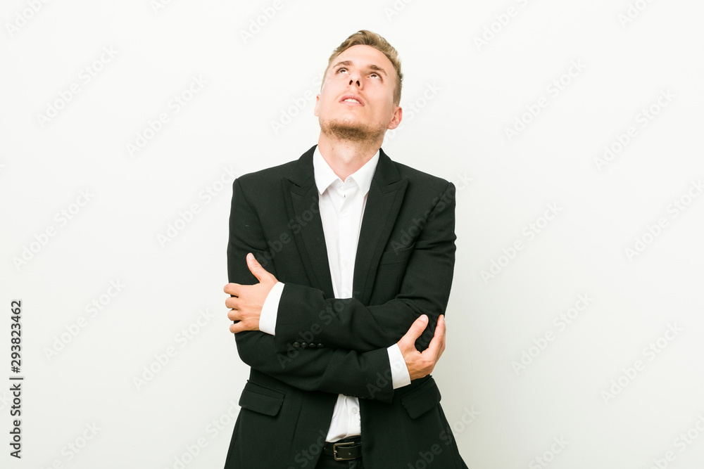 Young caucasian business man tired of a repetitive task. Young caucasian business man tired of a repetitive task.