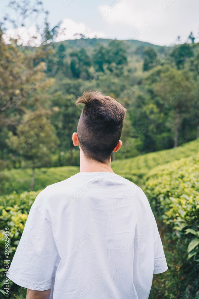 Tourist among many tea plantations in Nuwara Eliya, Sri Lanka