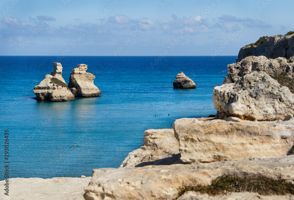 The Two Sisters stacks in front of the shore of Torre dell'Orso The Two Sisters stacks in front of the shore of Torre dell'Orso
