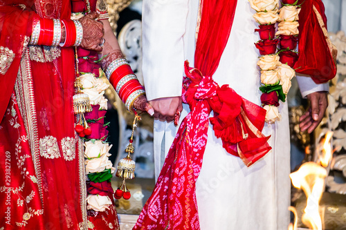 Indian hindu couple's holding hands on their wedding