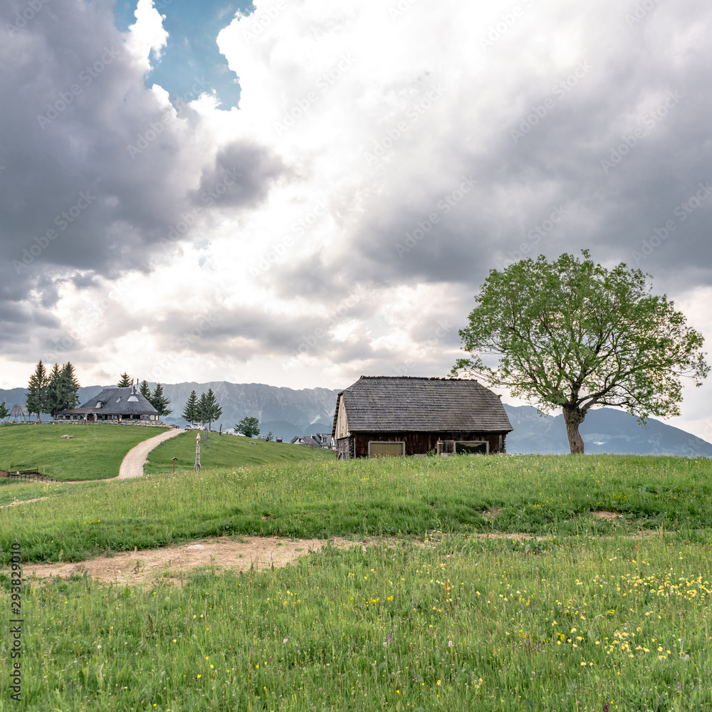 Fototapeta premium Mountain Range and Peaks with Old Shacks