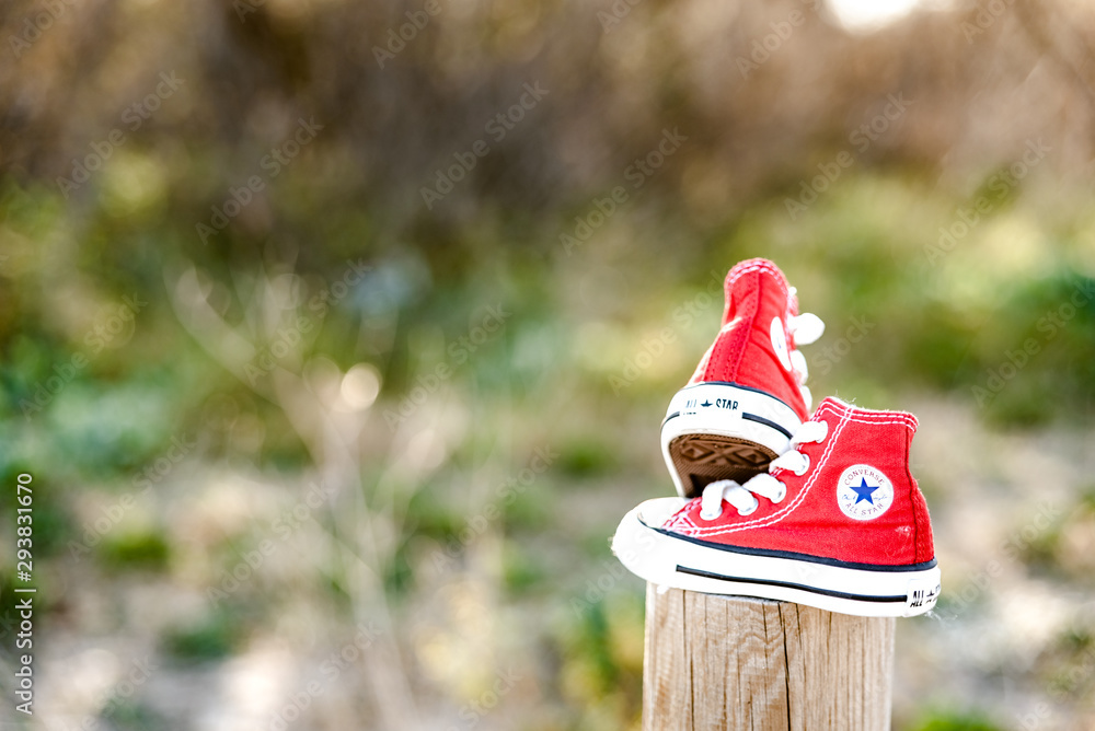 Valencia, Spain - March 3, 2019: Two red baby shoes from the Converse  brand. Stock Photo | Adobe Stock