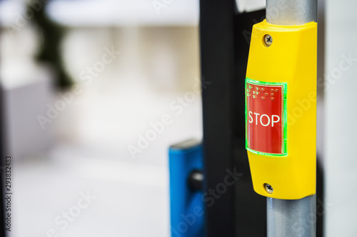 stop button modern and comfortable interior of the city bus. Convenient for disabled and elderly people