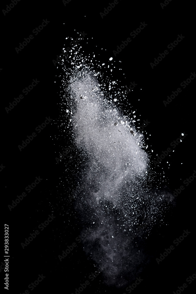 Obraz premium White powder splash isolated on black background. Flour sifting on a black background. Explosive powder white