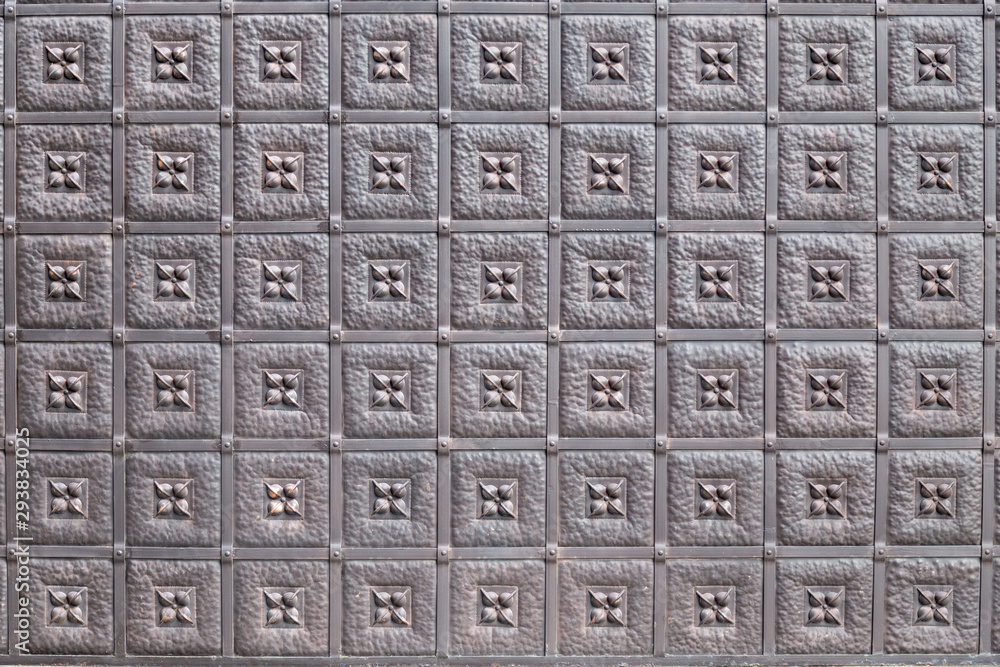 Metal fence pattern texture. Closeup on a modern metalic protective wall decoration. Metal fence pattern texture. Closeup on a modern metalic protective wall decoration.