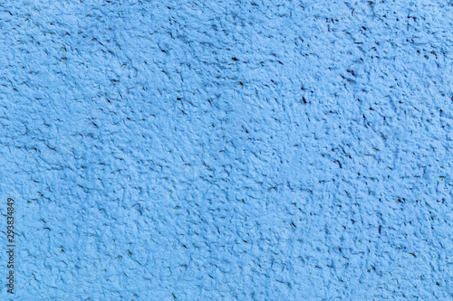 Closeup abstract background of blue concrete stucko wall with pore surface decoration of building facades.