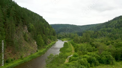 Flying above Maliy Inzer river among green forest photo