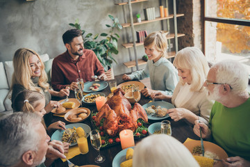 Portrait of nice charming cheerful cheery big full family brother sister eating domestic brunch lunch feast entertainment delicious meal dishes in modern loft industrial style interior house